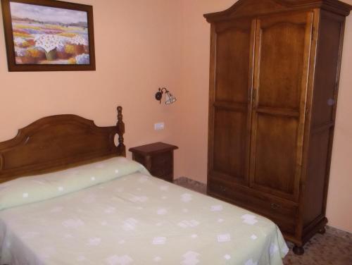 Cama o camas de una habitación en Hostal Monteolivos