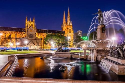 a view of a cathedral at night with a fountain at Comfy Private Single Room in Carramar - Nearby Station & Shops - Shared Bathroom in Sydney