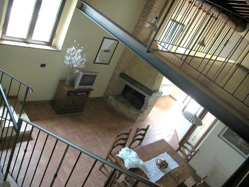 an overhead view of a room with a table and a fireplace at Podere Le Grotte in San Gimignano