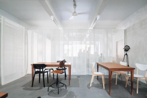a dining room with a table and chairs at Loyy Hotel in Chiang Mai