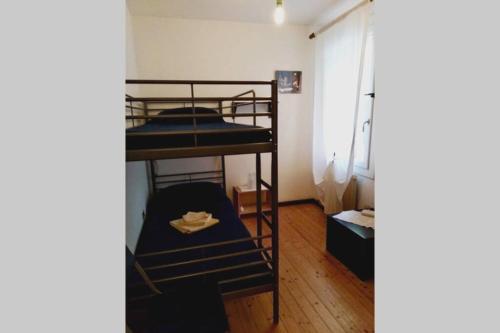 Двухъярусная кровать или двухъярусные кровати в номере Ca'Noa