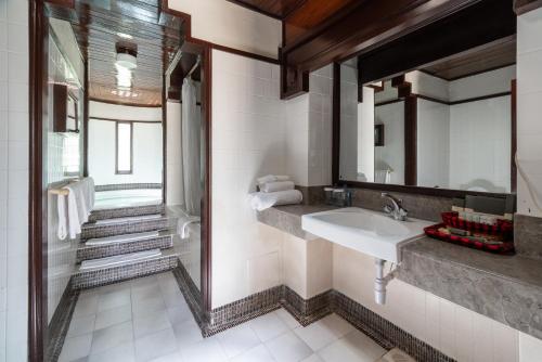 a bathroom with a sink and a mirror at Sarova Shaba Game Lodge in Archers Post