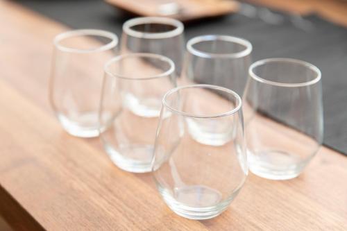 a group of wine glasses sitting on a table at RIVER VILLAS HIROSHIMA in Hiroshima