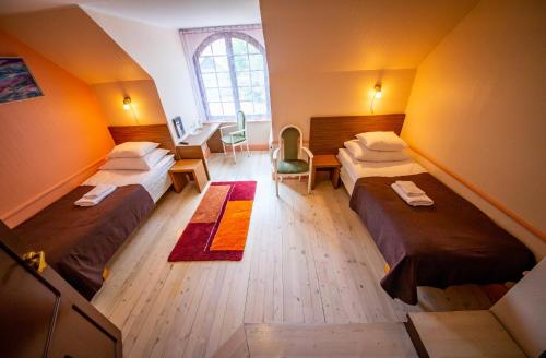 Postel nebo postele na pokoji v ubytování Hotel Liilia
