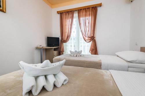 Postel nebo postele na pokoji v ubytování Hotel Ami - M