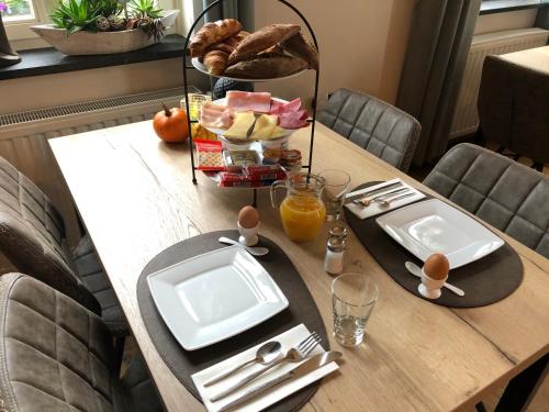 a table with a plate of food on top of it at Mert 5 in Beesel