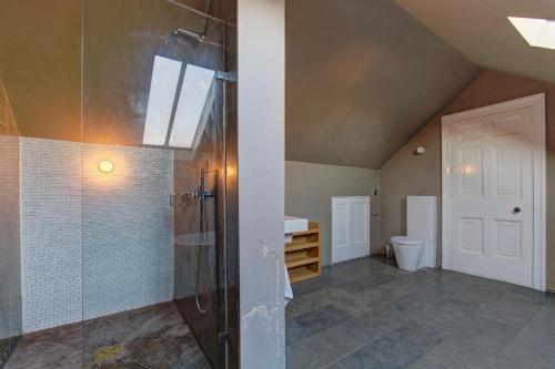 a bathroom with a shower and a toilet at Manchesters Ultimate House - Hot tub - Sleeps 23! in Manchester