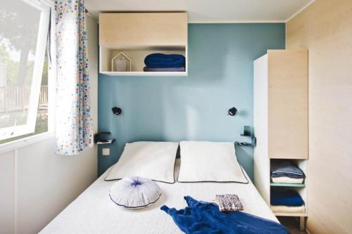 Ένα ή περισσότερα κρεβάτια σε δωμάτιο στο Camping Padimadour