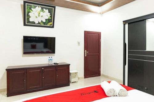 Ein Bett oder Betten in einem Zimmer der Unterkunft RedDoorz Plus near Universitas Methodist Medan