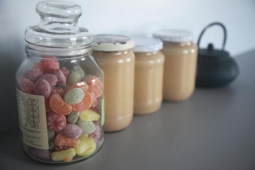 a glass jar filled with different types of candy at La Maison De Maria in Folembray