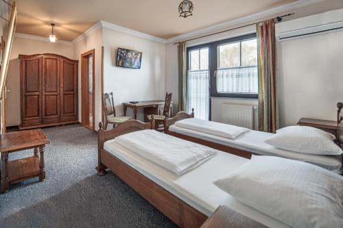 Postel nebo postele na pokoji v ubytování Garni Hotel Terano