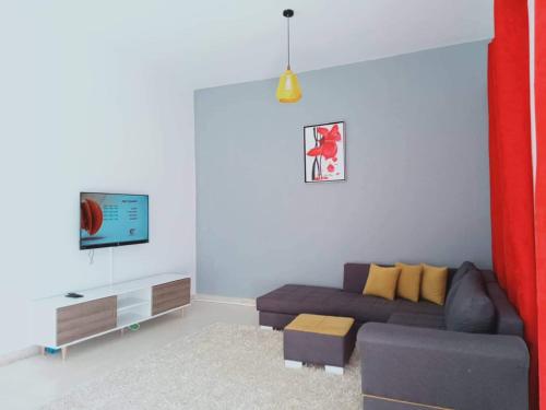TV a/nebo společenská místnost v ubytování Appartement Manzah 6