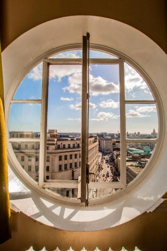 a round window with a view of a city at Adelphi Hotel in Liverpool