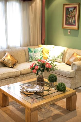 a living room with a couch and a coffee table at Beulah Hotel Boutique in Asuncion