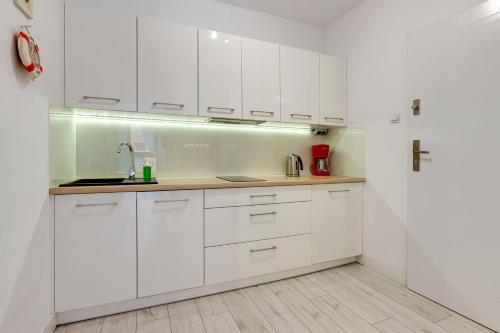 Η κουζίνα ή μικρή κουζίνα στο Staywin Apartments Chmielna Park