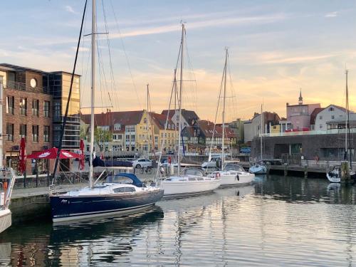 a group of boats are docked in a harbor at Hotel Kontorhaus Stralsund in Stralsund