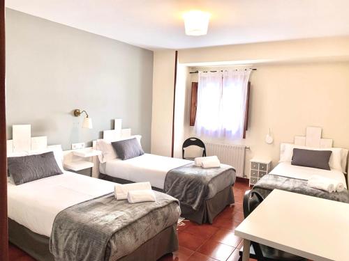 Кровать или кровати в номере Hotel Rural Tia Margot
