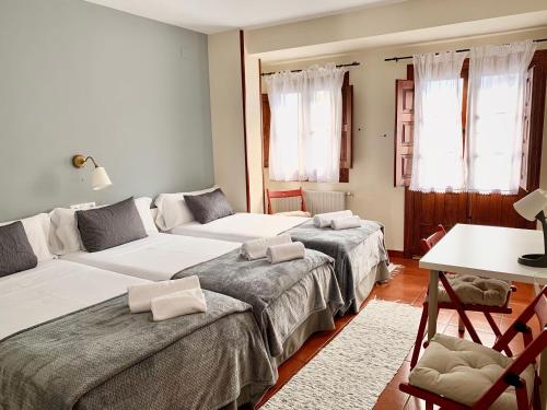 Кровать или кровати в номере Hotel Rural Tia Margot