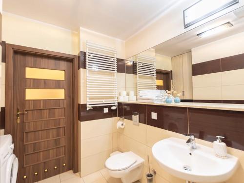 Koupelna v ubytování VacationClub – Olympic Park Apartament A106