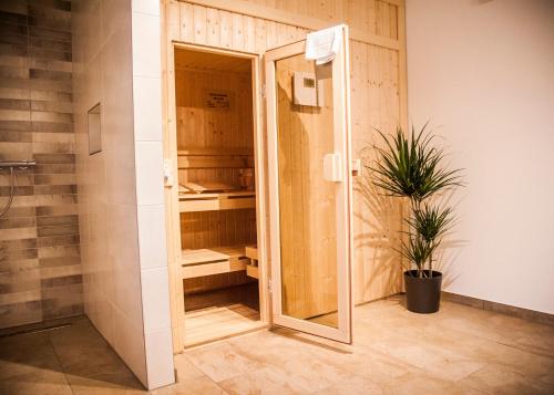 a shower with a glass door in a bathroom at Apartmenthaus Feldberg in Feldberg