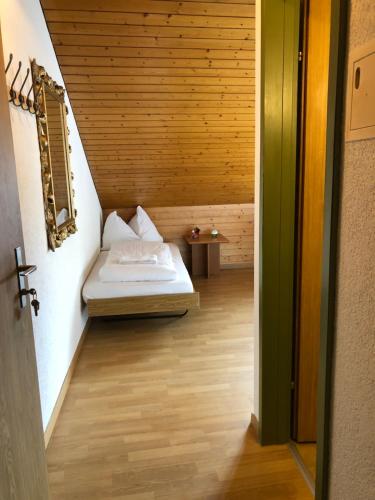 a small bedroom with a bed in a room at central beauty scenery apartment in Interlaken