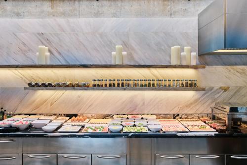a buffet line with many different types of food at Hotel Stary in Kraków