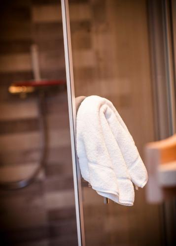 a white towel is hanging on a door at Apartmenthaus Feldberg in Feldberg