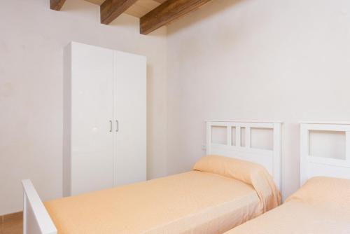 Una cama o camas en una habitación de Can Company