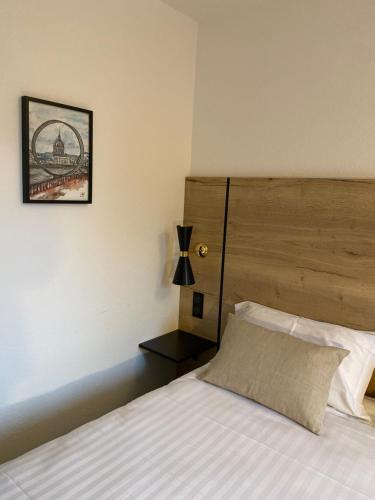 Ένα ή περισσότερα κρεβάτια σε δωμάτιο στο Hôtel AKENA Nantes Orvault - Ouest