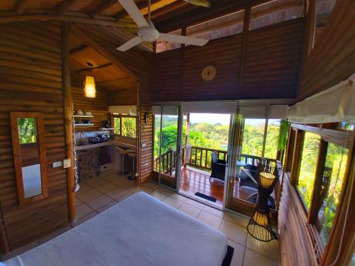 an inside view of a house with a porch at Horizon Hotel & Yoga Center in Santa Teresa Beach