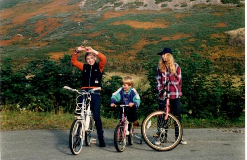 two women and a child on bikes on a road at Sea Song, Selkie House in Helmsdale