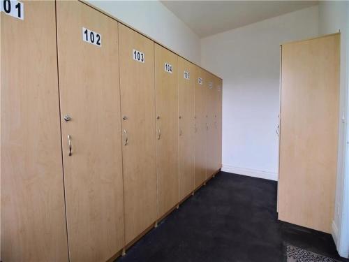 a row of lockers in an empty room at Splendid Mountain View Condo with Pool & BBQ- Ski, MTB, Cycling, Golf, Telework! in Bromont