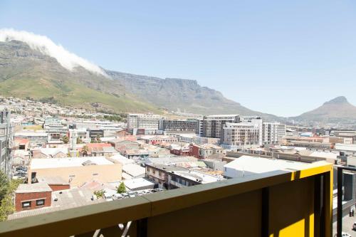 a view of a city with mountains in the background at Wex 1 Apartments in Cape Town