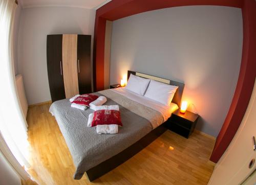 a bedroom with a bed with two towels at Vier Luxury House in Serres
