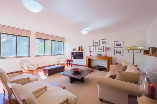 a living room with a couch and a fireplace at FLH Luxury Villa Mar with Private Sea Access in Caniçal