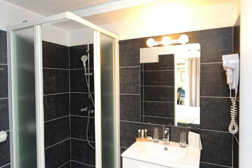 Koupelna v ubytování Hotel Le Tourisme