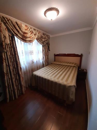 Ένα ή περισσότερα κρεβάτια σε δωμάτιο στο Apart Hotel El Doral