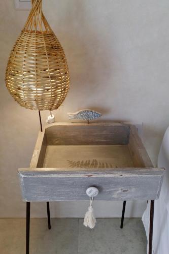 a wooden box with a light on top of it at Pousada Tartaruga Boutique Hotel in Pipa