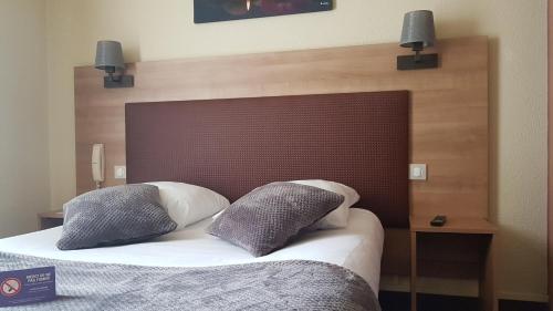 Una cama o camas en una habitación de Contact Hotel Atoll