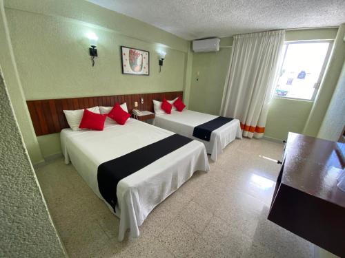 Lova arba lovos apgyvendinimo įstaigoje Hotel Batab