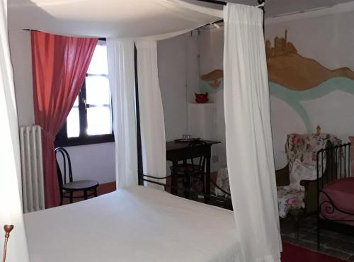 Postel nebo postele na pokoji v ubytování Agriturismo Olivazzi