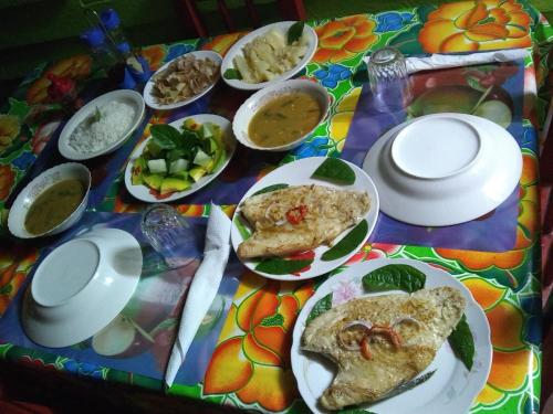 a table with plates of food on a table at Cabaña Belkys y Omar in Pinar del Río