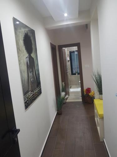 a hallway with a picture of a woman on the wall at Apartment FUNNY in Kotor