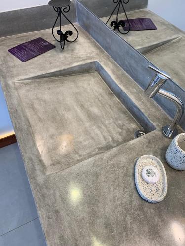 a sink in a counter top with a sink at Pousada Tartaruga Boutique Hotel in Pipa