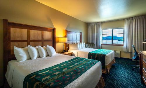 a hotel room with two beds and a window at The Mill Casino Hotel in North Bend