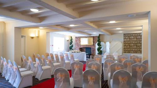 a room with a bunch of chairs and a table at Hotel Wrexham in Wrexham