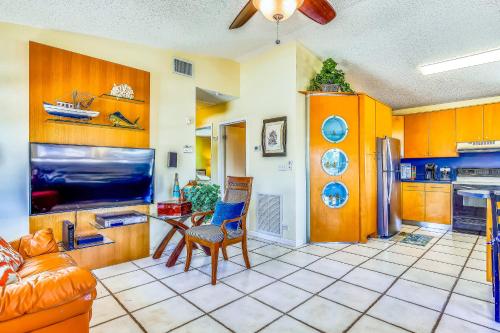 a kitchen with orange cabinets and a table and chairs at Burgundy Breeze in Tavernier