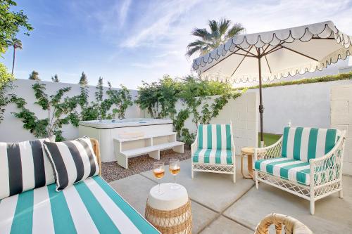 a patio with two chairs and a piano at Dive Palm Springs in Palm Springs