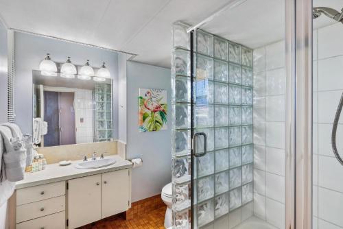 a bathroom with a shower and a sink at Maui Kai Condos in Lahaina