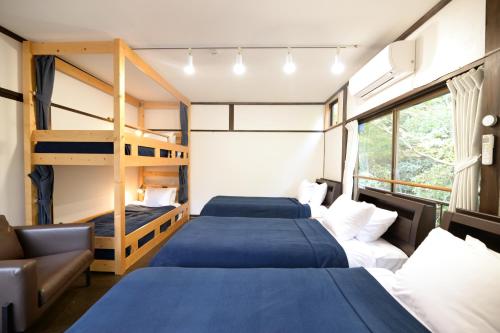 מיטה או מיטות בחדר ב-Uminomad